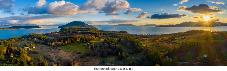 Aerial Panoramic View of Lummi island During a Glorious Sunset. Located in the Salish Sea, Orcas Island can be seen on the right with Bellingham Bay on the left. 
