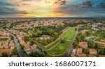 Aerial panoramic view of medieval walled Ferrara in Emilia Romagna Italy with dramatic sunset sky