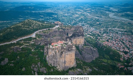 Aerial panoramic view of Meteora - a big monastery complex including nine reserved monastery built on top of difficult high cliffs resembling stone pillars 400 meters, Thessaly, Greece. - Shutterstock ID 2314166315