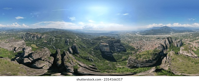 Aerial panoramic view of Meteora - a big monastery complex including nine reserved monastery built on top of difficult high cliffs resembling stone pillars 400 meters, Thessaly, Greece. - Shutterstock ID 2314166317