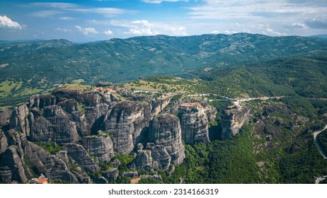 Aerial panoramic view of Meteora - a big monastery complex including nine reserved monastery built on top of difficult high cliffs resembling stone pillars 400 meters, Thessaly, Greece. - Shutterstock ID 2314166319