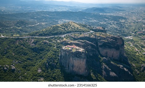 Aerial panoramic view of Meteora - a big monastery complex including nine reserved monastery built on top of difficult high cliffs resembling stone pillars 400 meters, Thessaly, Greece. - Shutterstock ID 2314166325