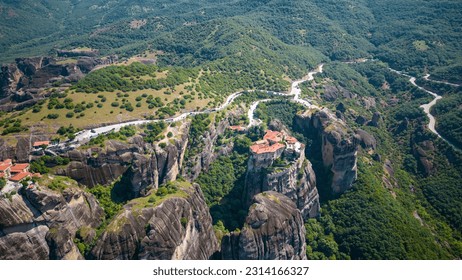 Aerial panoramic view of Meteora - a big monastery complex including nine reserved monastery built on top of difficult high cliffs resembling stone pillars 400 meters, Thessaly, Greece. - Shutterstock ID 2314166327