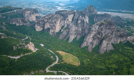 Aerial panoramic view of Meteora - a big monastery complex including nine reserved monastery built on top of difficult high cliffs resembling stone pillars 400 meters, Thessaly, Greece. - Shutterstock ID 2314166329