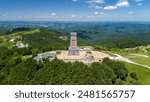 Aerial panoramic view of the monument of freedom on shipka peak in bulgaria on a sunny summer day