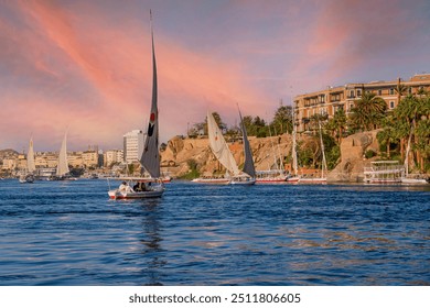 Aerial panoramic view of the Nile river with Feluccas (traditional egyptian sailing boats) in Aswan, Egypt - Powered by Shutterstock