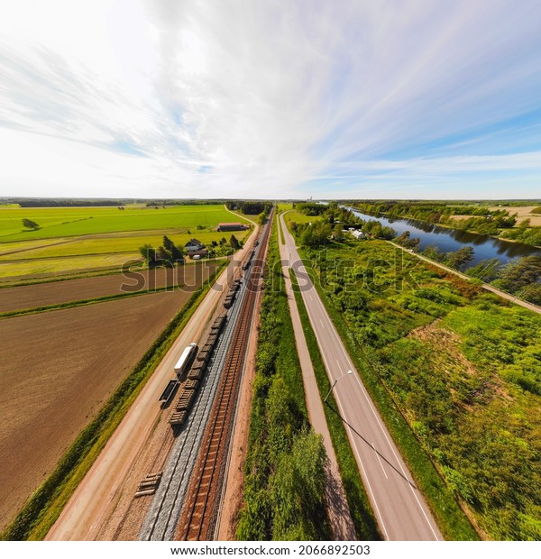 Aerial panoramic view of pathway, road\
and railway in place Myllykoski in Kouvola,\
Finland.