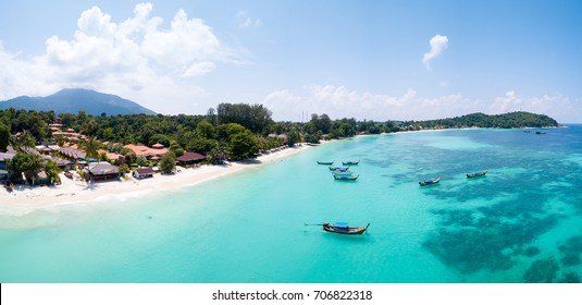 Aerial panoramic view of Pattaya Beach over crystal clear tropical water on island paradise Ko Lipe, Thailand
