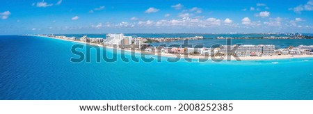 Aerial panoramic view of Punta Norte beach, Cancun, México. Beautiful beach area with luxury hotels near the Caribbean sea in Cancun, Mexico.