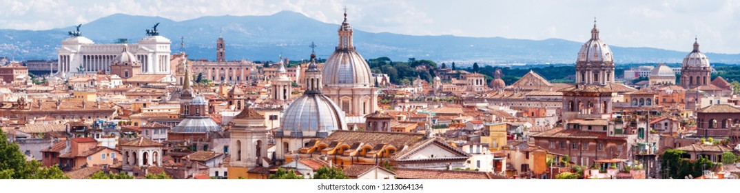 Aerial panoramic view of Rome, Italy. Beautiful Rome skyline in summer. Wide panorama of old Roma city from above. Nice scenery of historical area of Rome. Horizontal banner with Rome for web.