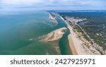 Aerial panoramic view of the Rompido Arrow (La Flecha del Rompido), a sand bank formed on the Rompido and Portil beaches that already reaches La Bota beach, in the municipality of Punta Umbria, Huelva