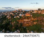 Aerial panoramic view of Rova - Royal palace complex with houses in Antananarivo - capital city of  Madagascar cityscape.