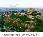 Aerial panoramic view of Rova - Royal palace complex with houses in Antananarivo - capital city of  Madagascar cityscape.