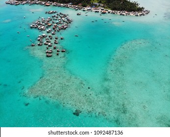 Aerial panoramic view of the Sea Gypsy homes known as Bajau Laut in Denawan Island in Semporna, Sabah, Malaysia. Beautiful blue lagoon and coral reef surrounded their homes.
 - Shutterstock ID 1092487136
