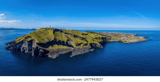 Aerial and panoramic view of sea and lighthouse on the peak of Udo Island against horizon near Jeju-si, Jeju-do, South Korea
 - Powered by Shutterstock