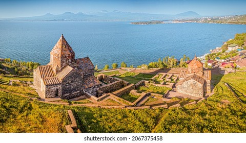 Aerial panoramic view to Sevanavank Monastery and chapel overlooking famous Sevan lake at sunny spring day. Travel and tourist destinations of Armenia