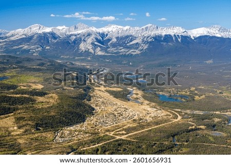Aerial panoramic view of Town of Jasper in summer time. Jasper National Park, Alberta, Canada. Canadian Rockies.