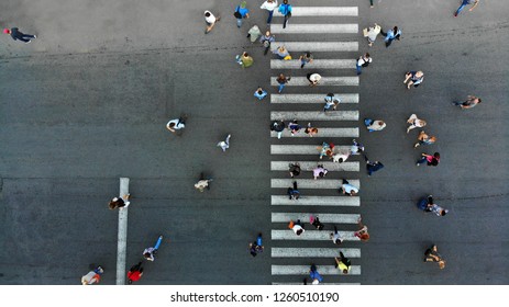 Aerial. Pedestrian crossing crosswalk and crowd of peolple. 