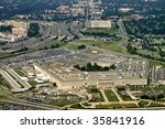 Aerial of the Pentagon, the Department of Defense headquarters in Arlington, Virginia, near Washington DC, with I-395 freeway on the left, and the Air Force Memorial up middle.