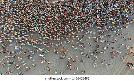 Aerial. People Crowd On A City Square. Mass Gathering Of Many People In One Place. Top View From Drone Fly. 