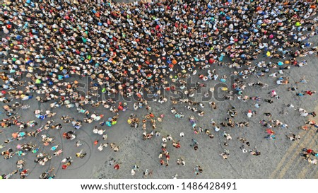 Similar – Aerial View From Flying Drone Of People Crowd Relaxing On Algarve Beach In Portugal