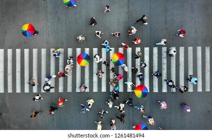 Aerial. People Crowd On A Pedestrian Crossing Crosswalk. View Above.