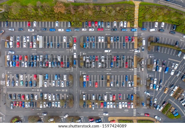 Aerial photo above a busy\
car park taken in the winter time in the town of Colton in Leeds\
West Yorkshire