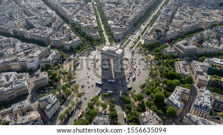 Aerial photo of the Arc de Trioumphe in Paris, France. Photo taken early morning, Champs Elysees leads from the Arc to the top right corner of the photo. 