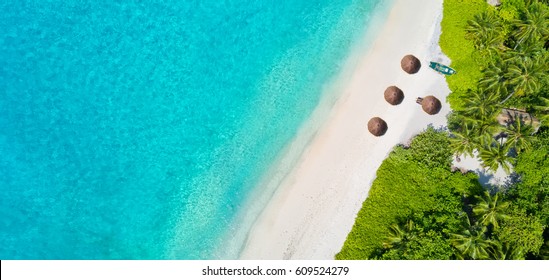 Aerial photo of beautiful paradise Maldives tropical beach on island. Summer and travel vacation concept.