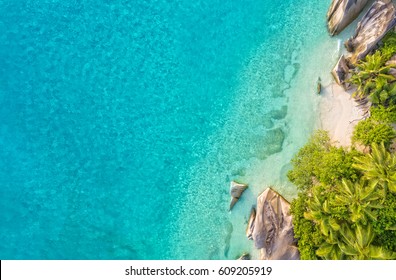 Aerial photo of beautiful paradise Seychelles tropical beach Anse Source D Argent at La Digue island. Summer vacation and travel concept