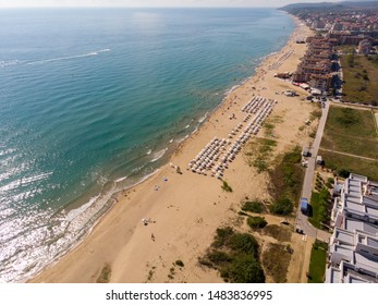 Aerial photo of the beautiful small town and seaside resort of Obzor in Bulgaria showing the coastal hotels and people relaxing and having fun on the golden sunny beach of the Black Sea coast - Shutterstock ID 1483836995