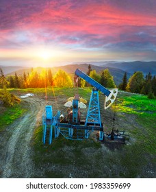 Aerial Photo By Drone Of An Oil And Gas Field In Ukraine, Carpathians, Ivano-Frankivsk Region, Dora Village Near The Resort Town Of Yaremche. Oil Pumps Among Wild Forests