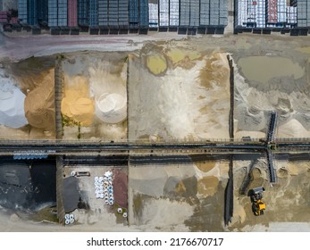 Aerial Photo Of Excavator On Industrial Place. Industrial Site Top View. Shooting From The Drone.