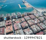 Aerial photo of harbour Naufragos Acequion, residential houses, highways and Mediterranean Sea of Torrevieja. High angle view famous popular travel destination. Costa Blanca. Alicante province. Spain.