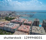 Aerial photo of harbour Naufragos Acequion, residential houses, highways and Mediterranean Sea of Torrevieja. High angle view famous popular travel destination. Costa Blanca. Alicante province. Spain.