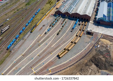 Aerial Photo Of A Lot Of Hopper Car / Hopper Wagon Old Rusty Train Cargo  Trucks On Train Tracks In A Storage Shed Located In The Town Of York In West Yorkshire In The UK