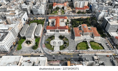 Aerial photo of iconic landmark neoclassic buildings of Academy, University and public Library in the heart of Athens historic centre, Attica, Greece
