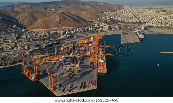 Aerial photo of industrial cargo container\
terminal in Perama and Drapetsona commercial port near Piraeus,\
Attica, Greece