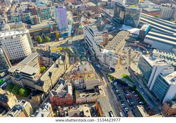 Aerial photo of the Leeds\
Train Station, it also shows construction work being done on the\
old Majestic building located in the Leeds City Centre in West\
Yorkshire UK
