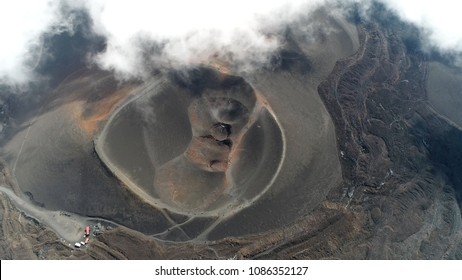 Aerial Photo Mount Etna Volcanic Crater One Of The Flank Craters Is Roughly Circular Depression In Ground Caused By Volcanic Activity And Is Typically Bowl-shaped Feature Also Showing People Walking