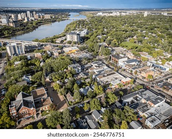 Aerial photo of the Nutana neighborhood in Saskatoon, Saskatchewan, highlighting historic homes, tree-lined streets, parks, and scenic views of the South Saskatchewan River in this vibrant community. - Powered by Shutterstock