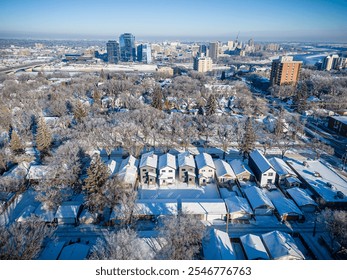 Aerial photo of the Nutana neighborhood in Saskatoon, Saskatchewan, highlighting historic homes, tree-lined streets, parks, and scenic views of the South Saskatchewan River in this vibrant community. - Powered by Shutterstock