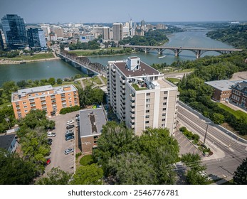 Aerial photo of the Nutana neighborhood in Saskatoon, Saskatchewan, highlighting historic homes, tree-lined streets, parks, and scenic views of the South Saskatchewan River in this vibrant community. - Powered by Shutterstock