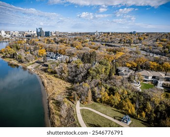 Aerial photo of the Nutana neighborhood in Saskatoon, Saskatchewan, highlighting historic homes, tree-lined streets, parks, and scenic views of the South Saskatchewan River in this vibrant community. - Powered by Shutterstock