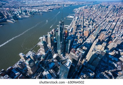 Aerial photo over World trade center building with 9/11 Memorial and Lower Manhattan in the background