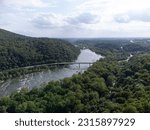 An aerial photo of the Shenandoah River Bridge in Harpers Ferry which passes over the Shenandoah River.
