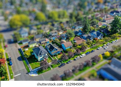 Aerial Photo Of A Small Town Neighborhood With Tilt-shift Lens Effect Applied To Give Tiny Table-top Model Appearance