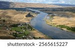 aerial photo of the Snake River, Swallows Nest Rock and Lewiston ID and Clarkston WA in the background