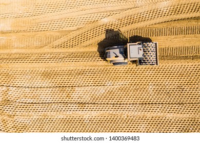 Aerial Photo Of A Steam Roller And A Backhoe On A Roadwork