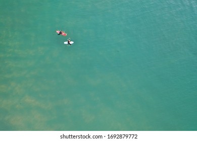 Aerial Photo of Surfers in clean ocean